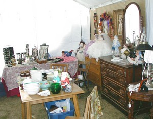 A peek inside our tent! See Tara's jewelry and the old walnut dresser?